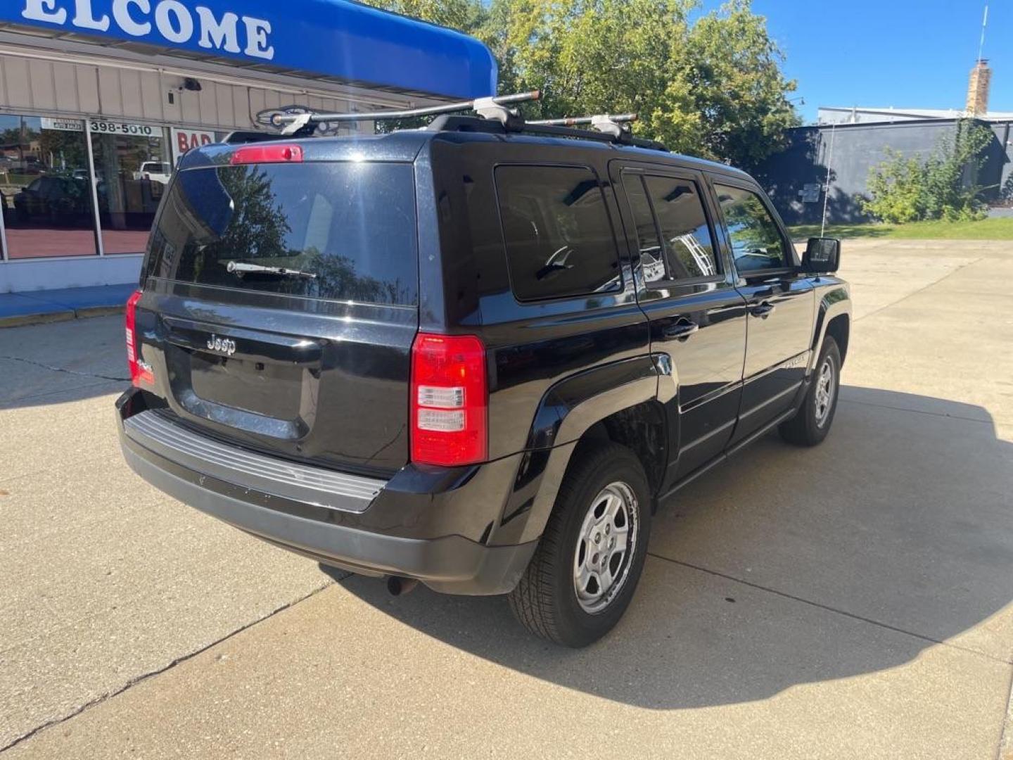 2014 BLACK JEEP PATRIOT SPORT (1C4NJRBB4ED) with an 2.4L engine, Continuously Variable transmission, located at 1708 Broadway, Rockford, IL, 61104, (815) 397-5010, 42.252522, -89.069359 - Photo#2