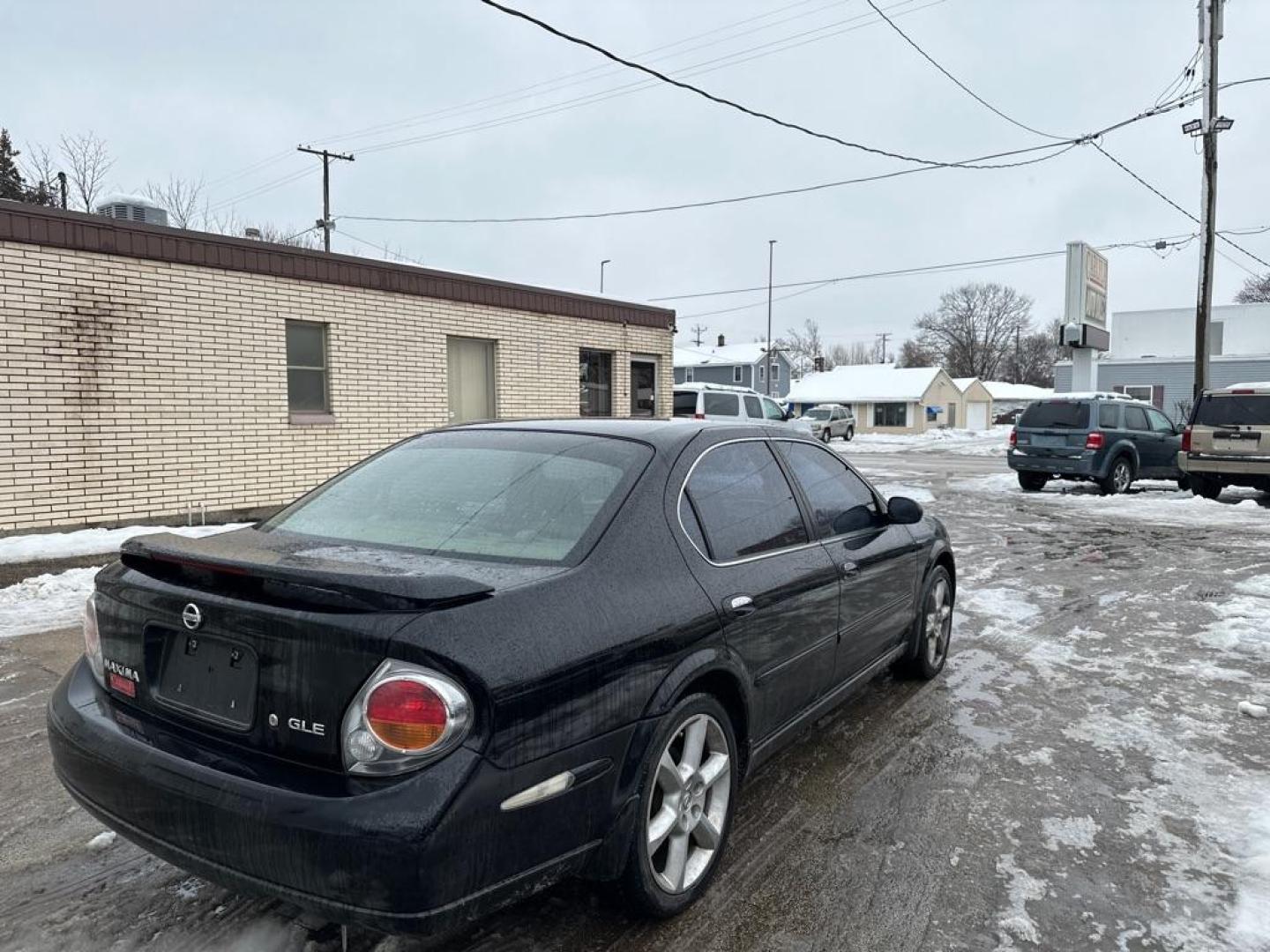 2003 BLACK NISSAN MAXIMA GLE (JN1DA31A53T) with an 3.5L engine, Automatic transmission, located at 1708 Broadway, Rockford, IL, 61104, (815) 397-5010, 42.252522, -89.069359 - Photo#2