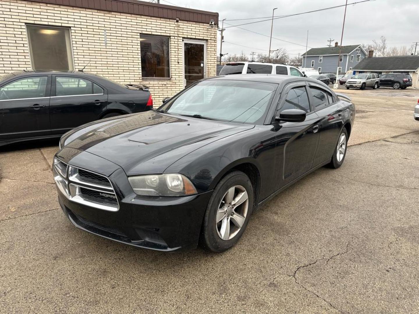 2012 BLACK DODGE CHARGER SE (2C3CDXBG5CH) with an 3.6L engine, Automatic transmission, located at 1708 Broadway, Rockford, IL, 61104, (815) 397-5010, 42.252522, -89.069359 - Photo#0