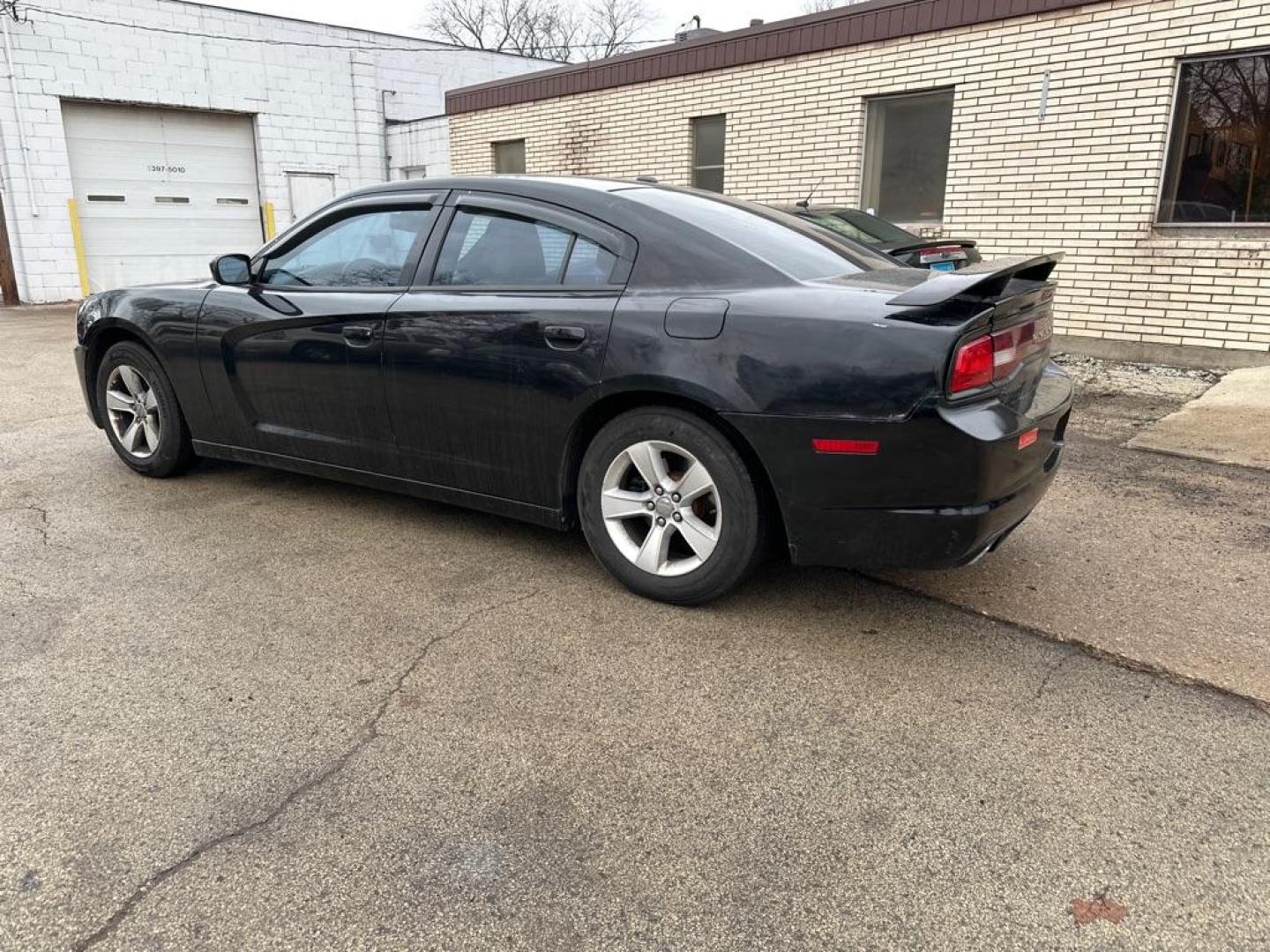 2012 BLACK DODGE CHARGER SE (2C3CDXBG5CH) with an 3.6L engine, Automatic transmission, located at 1708 Broadway, Rockford, IL, 61104, (815) 397-5010, 42.252522, -89.069359 - Photo#1