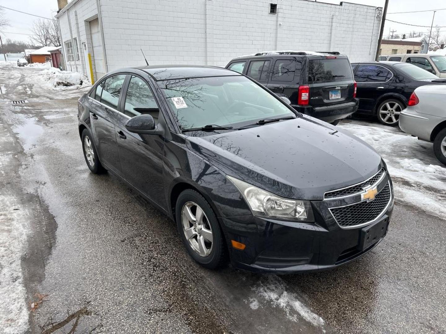 2012 BLACK CHEVROLET CRUZE LT (1G1PF5SC1C7) with an 1.4L engine, Automatic transmission, located at 1708 Broadway, Rockford, IL, 61104, (815) 397-5010, 42.252522, -89.069359 - Photo#4