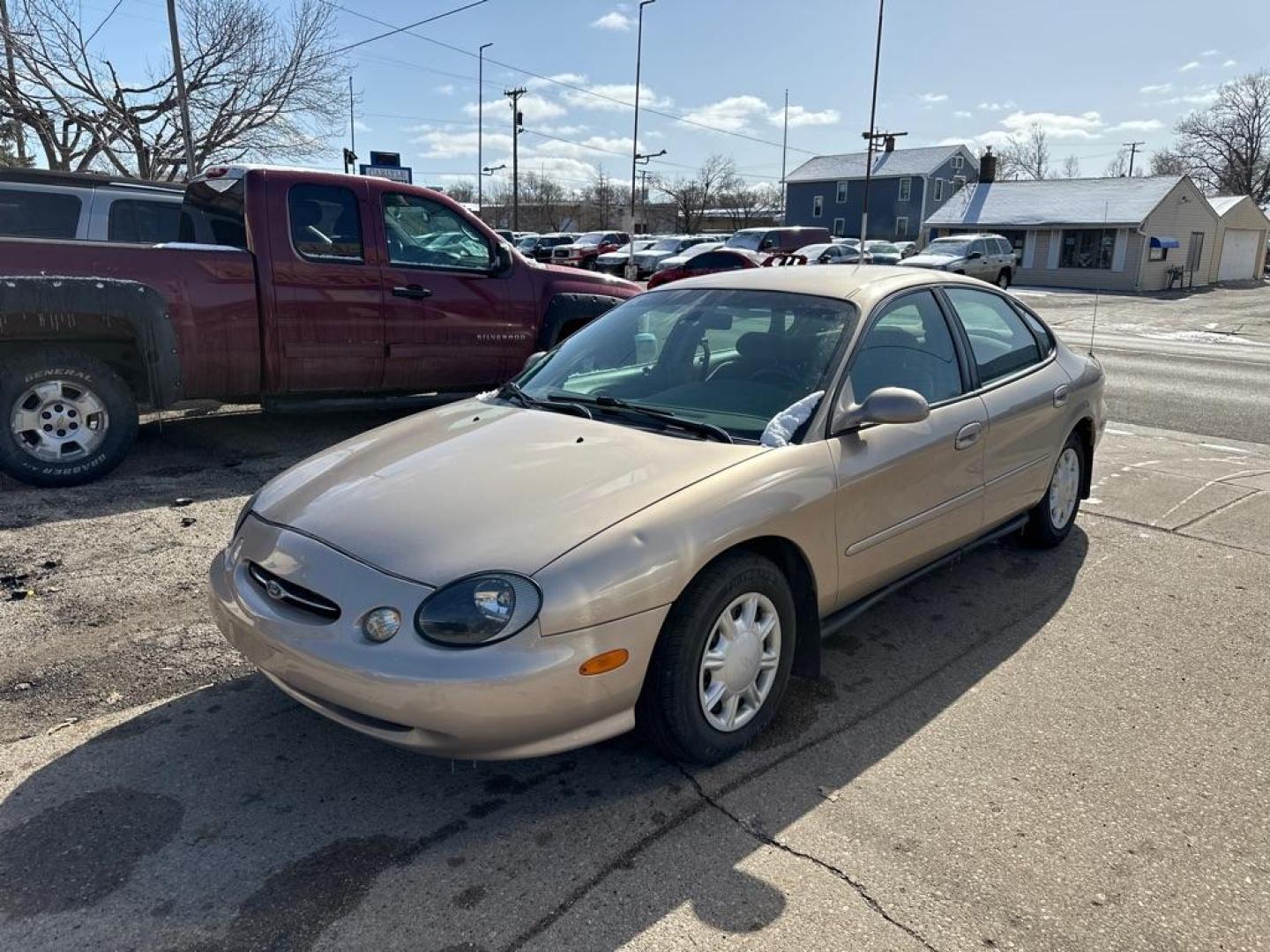 1998 GOLD FORD TAURUS LX (1FAFP52U2WG) with an 3.0L engine, Automatic transmission, located at 1708 Broadway, Rockford, IL, 61104, (815) 397-5010, 42.252522, -89.069359 - Photo#0