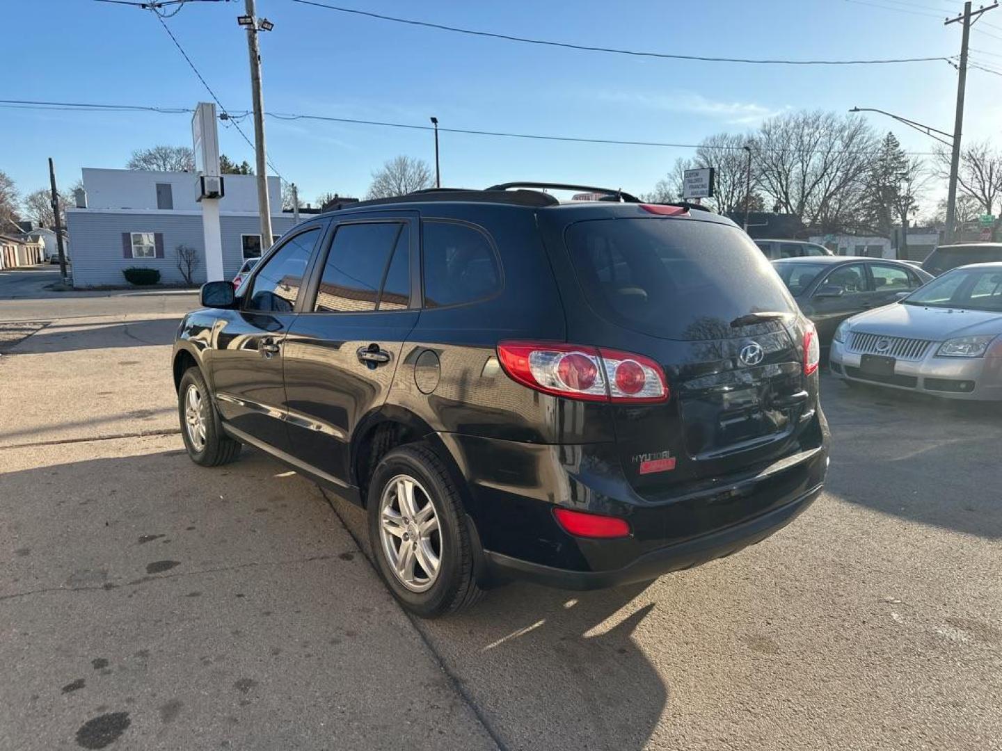 2011 BLACK HYUNDAI SANTA FE GLS (5XYZG3AB5BG) with an 2.4L engine, Automatic transmission, located at 1708 Broadway, Rockford, IL, 61104, (815) 397-5010, 42.252522, -89.069359 - Photo#1