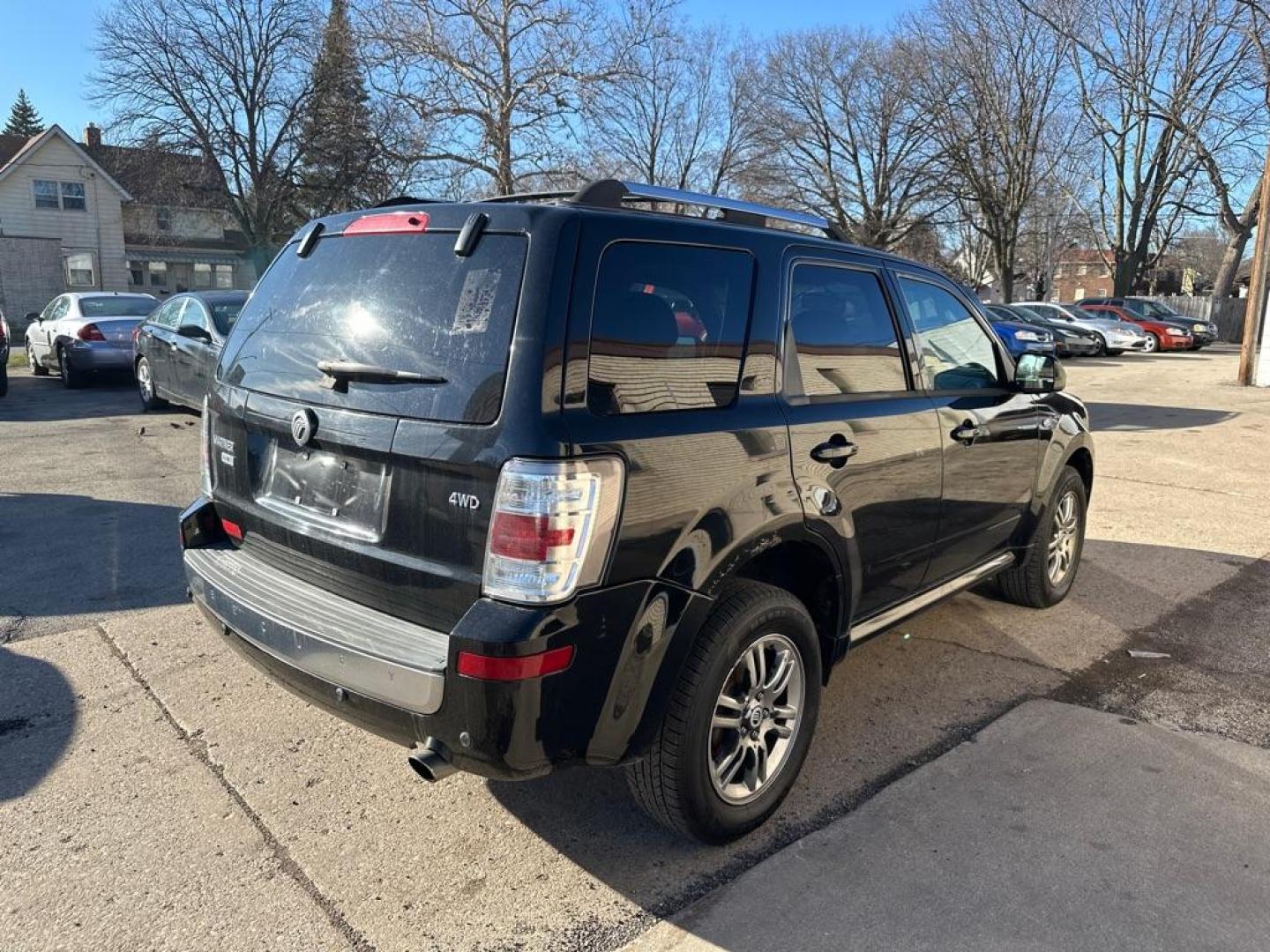 2009 BLACK MERCURY MARINER PREMIER (4M2CU97G09K) with an 3.0L engine, Automatic transmission, located at 1708 Broadway, Rockford, IL, 61104, (815) 397-5010, 42.252522, -89.069359 - Photo#2