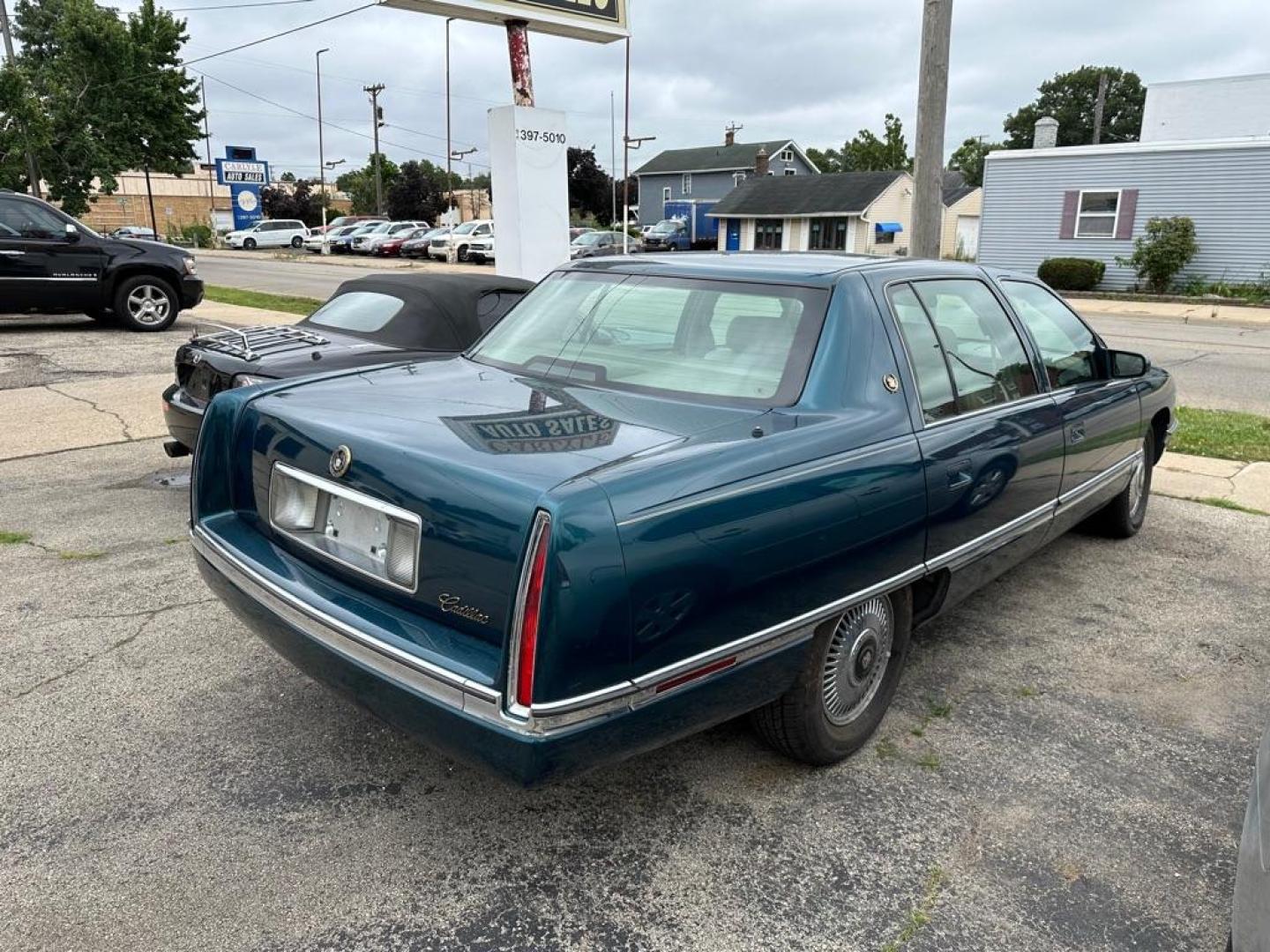 1995 GREEN CADILLAC DEVILLE (1G6KD52B9SU) with an 4.9L engine, Automatic transmission, located at 1708 Broadway, Rockford, IL, 61104, (815) 397-5010, 42.252522, -89.069359 - Photo#1