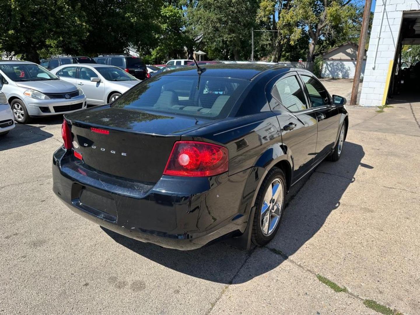 2014 BLACK DODGE AVENGER SE (1C3CDZAB9EN) with an 2.4L engine, Automatic transmission, located at 1708 Broadway, Rockford, IL, 61104, (815) 397-5010, 42.252522, -89.069359 - Photo#2