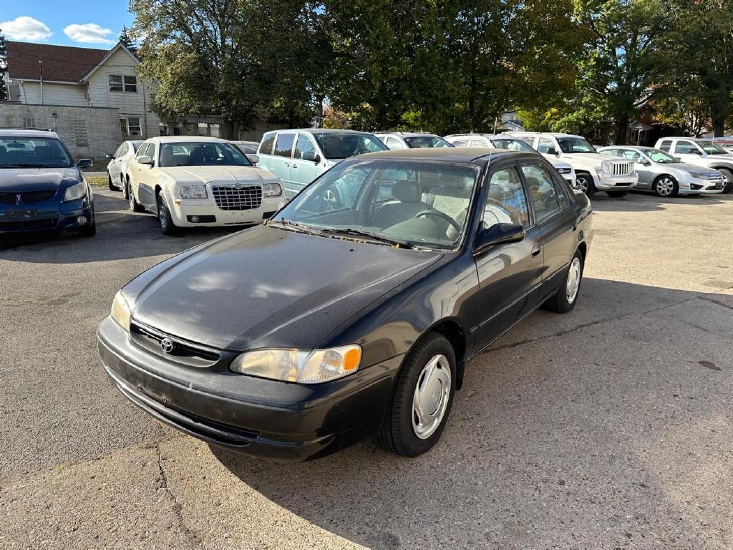 1998 BLACK TOYOTA COROLLA VE (1NXBR18E4WZ) with an 1.8L engine, Automatic transmission, located at 1708 Broadway, Rockford, IL, 61104, (815) 397-5010, 42.252522, -89.069359 - Photo#0