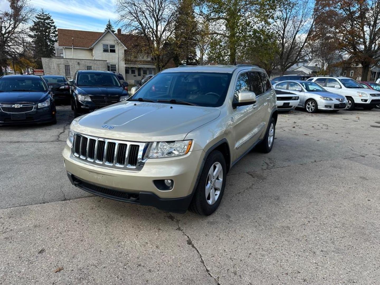 2011 GOLD JEEP GRAND CHEROKEE LAREDO (1J4RR4GG1BC) with an 3.6L engine, Automatic transmission, located at 1708 Broadway, Rockford, IL, 61104, (815) 397-5010, 42.252522, -89.069359 - Photo#0