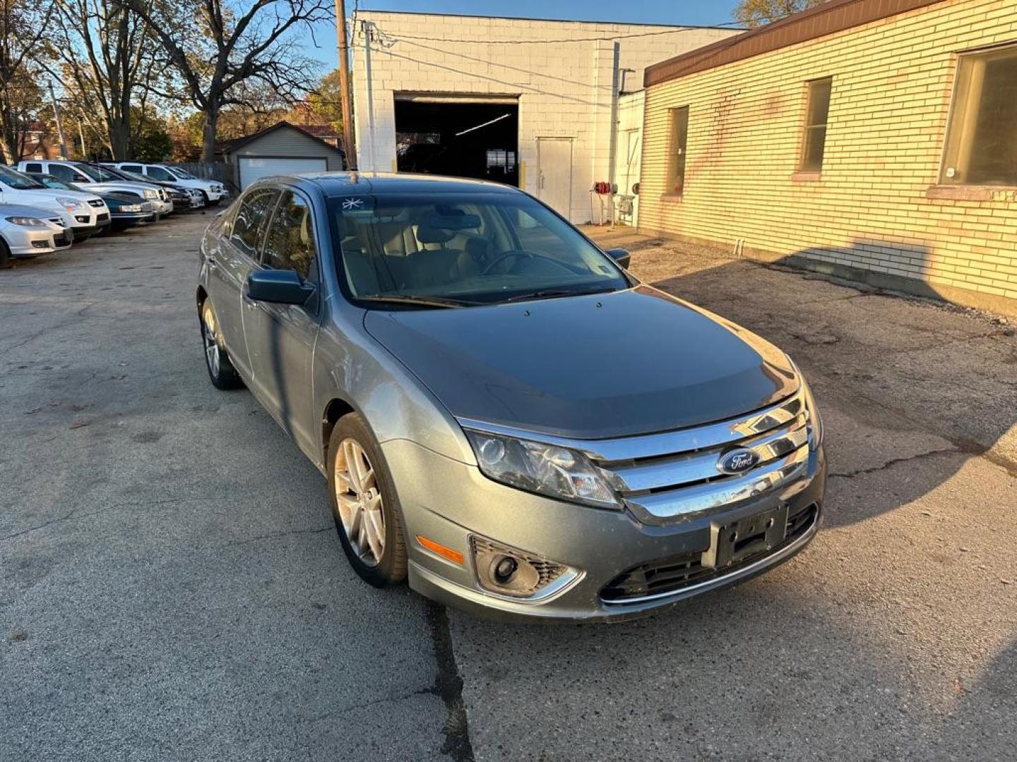 2011 BLUE FORD FUSION SEL (3FAHP0JA9BR) with an 2.5L engine, Automatic transmission, located at 1708 Broadway, Rockford, IL, 61104, (815) 397-5010, 42.252522, -89.069359 - Photo#2