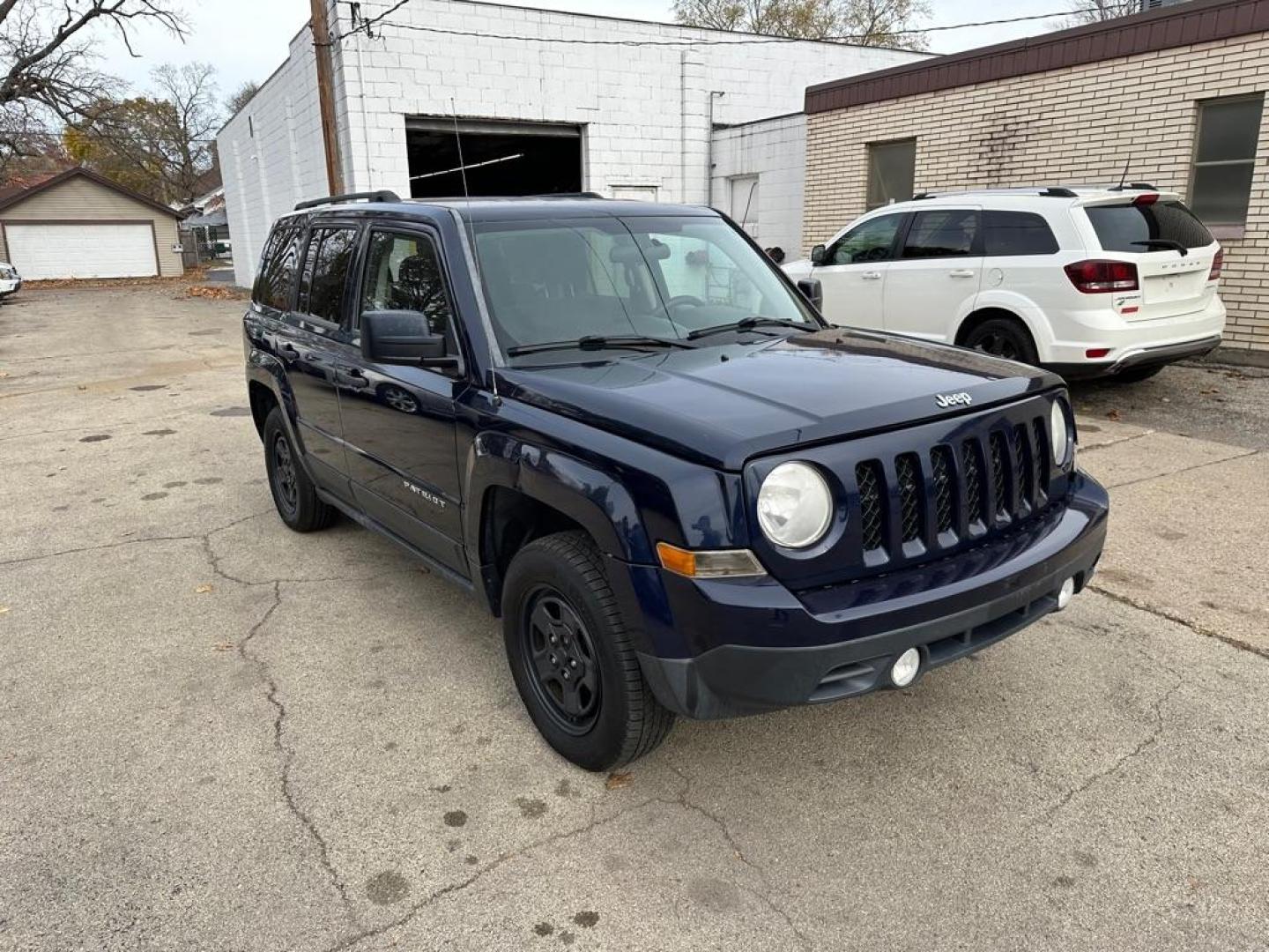 2014 BLUE JEEP PATRIOT SPORT (1C4NJPBB6ED) with an 2.4L engine, Continuously Variable transmission, located at 1708 Broadway, Rockford, IL, 61104, (815) 397-5010, 42.252522, -89.069359 - Photo#2