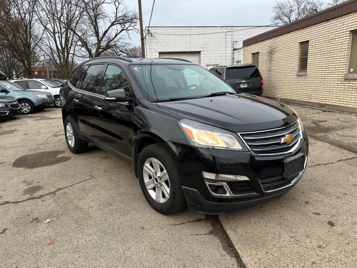 2013 BLACK CHEVROLET TRAVERSE LT (1GNKVGKD1DJ) with an 3.6L engine, Automatic transmission, located at 1708 Broadway, Rockford, IL, 61104, (815) 397-5010, 42.252522, -89.069359 - Photo#2